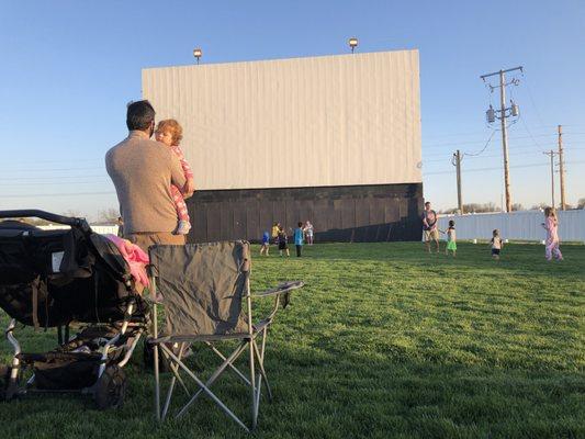 The view of the screen from our front row seats. It's not movie time yet though.