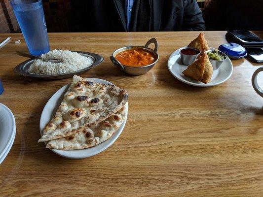 The food is fantastic. Pictured: Beef Samosas, Naan, rice, grilled chicken