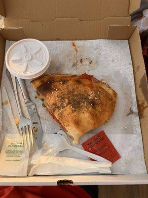 1/2 of a $7 (!) custom Calzone. The most delicious, tastes better than the ones I used to get in NYC and CT.