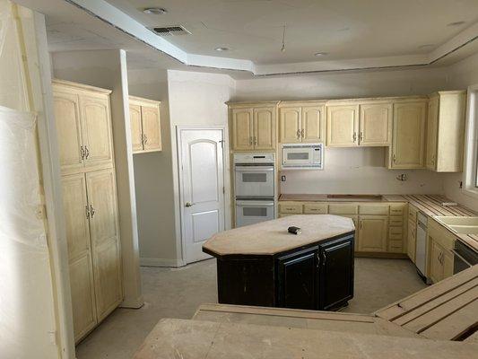 Customer wanted kitchen, cabinets, bar areas and door painted.