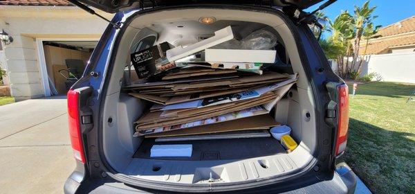 Car full of cardboard boxes