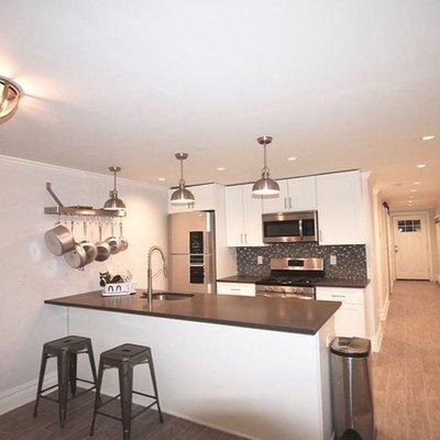 This open floor plan makes this kitchen we built look so much brighter.