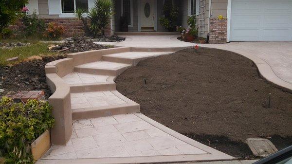 Concrete steps with a small retaining wall