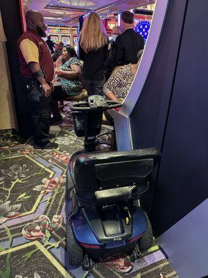 Casino management and The unoccupied scooter that was sitting across the aisle from where my Sister that is a paraplegic.