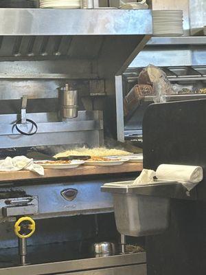 Spatula resting on people's cooked hashbrowns