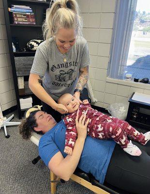 Dr. Lora adjusting my baby daughter.