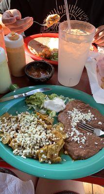 Green chilaquilas with chorizo and refried beans