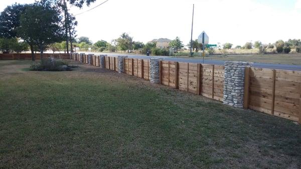 Rock Columns and Wood Fence