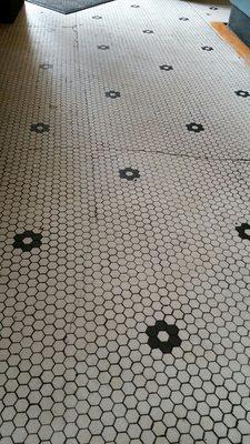 Original tile laid back in the 20's when this was a bank.  The tin ceiling in other photos is also original.