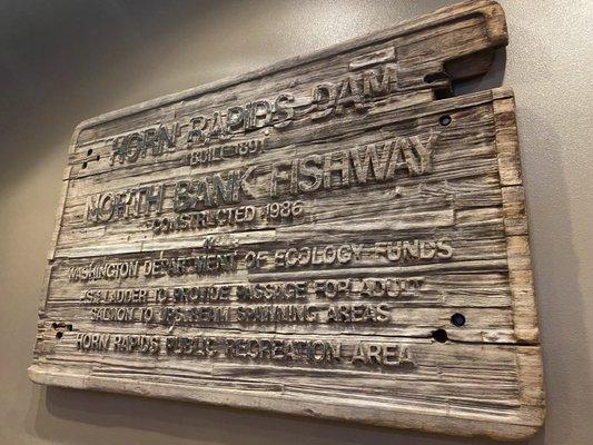 Old, solid wood sign with a story.