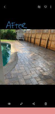 This is a beautiful after photo of a paver pool deck we did & a hot tub area