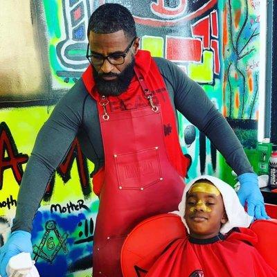 Customer enjoying a facial treatment at His and Hers Grooming Bar.