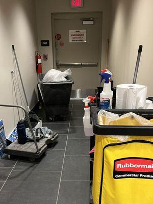 Maintenance equipment blocking the emergency exit. You may wanna ask your attorney about this.