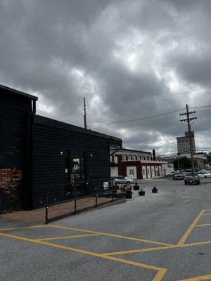 Exterior outside. Private parking lot, outdoor seating, and drive thru (when available).