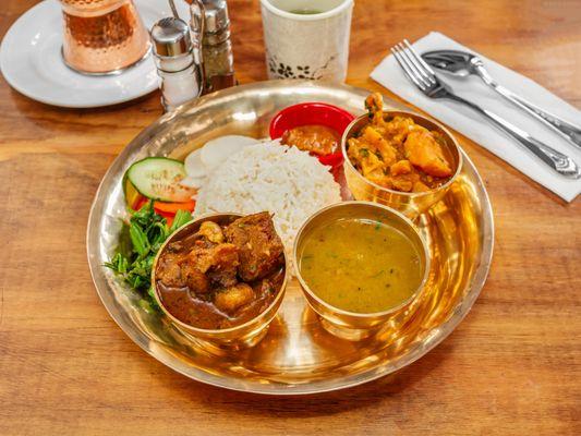 goat thali
a traditional combination platter served with rice,dal(lentel soup),veg curry,salad,achar(pickle) and choice of meat