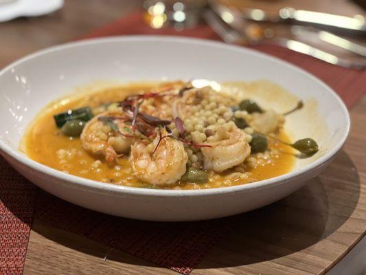 Shrimp Scampi with a twist. Caper berries, Calabrian Chili butter and Fregola pasta