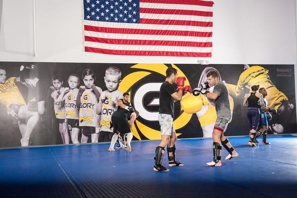 Adult MMA class in session. A great program to get in shape in a clean, fun environment. Learn more: