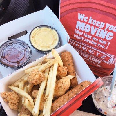 Pick 3 appetizer sampler with mozzarella sticks, popcorn chicken, fryz, marinara sauce, and honey mustard