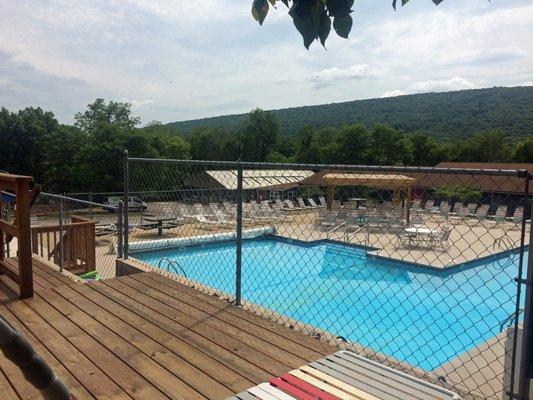 A view of the outdoor pool from one of the decks. There are also 2 hot tubs and a poolside cafe/grill to enjoy.