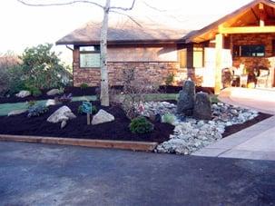 Installed a bubbling rock fountain w/ river rock pond splash area.