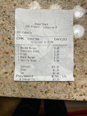 $36 for 2 tiny burgers, 2 small drinks and 1 French Fry order at a fast food restaurant.