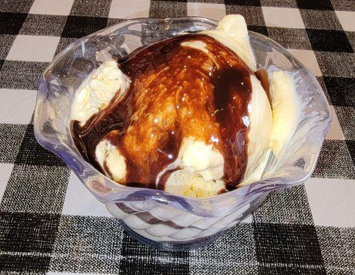 Vanilla ice cream with chocolate syrup.