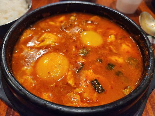 Tofu soup with beef and an extra egg.     hot is the best way to order this.