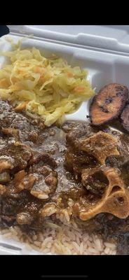 I got the Ox Tail Plate; it already comes w/ the cabbage & plantains.