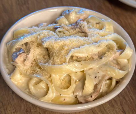 Kid's Fettuccine Alfredo with added chicken.