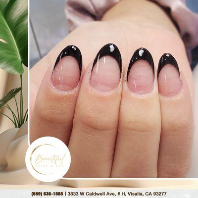 Go beyond the basics with black French tips--where timeless elegance meets a modern, daring edge