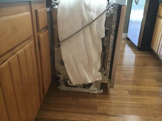 Dishwasher UN-installed to wait a month for repair.