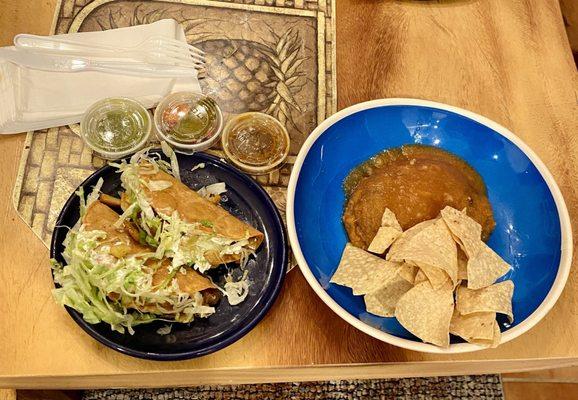 Chile relleno and 2 potato tacos with chips and salsa to go.