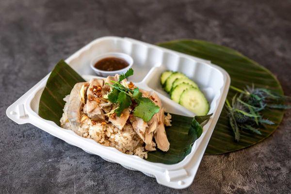 Khao Mun GaiKHAO MUN GAI Poached chicken skinless chicken thigh over coconut, ginger and garlic rice served with soybean chili sauce.