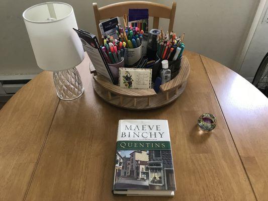 Lazy Susan for my art supplies and an author I've never read but looks like a refreshing change from my more dramatic and educational books.