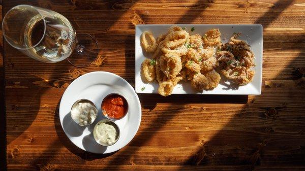 Crispy calamari with trio of dipping sauces.