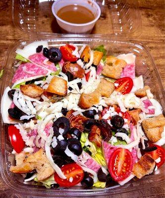 Sicilian Chef Salad - mixed greens, grape tomatoes, shredded mozz, black olives, salami, provolone, house croutons & balsamic dressing