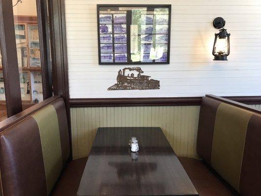 Comfy booths you can breathe in. Notice the attention to detail as you wait for lunch. It's everywhere.