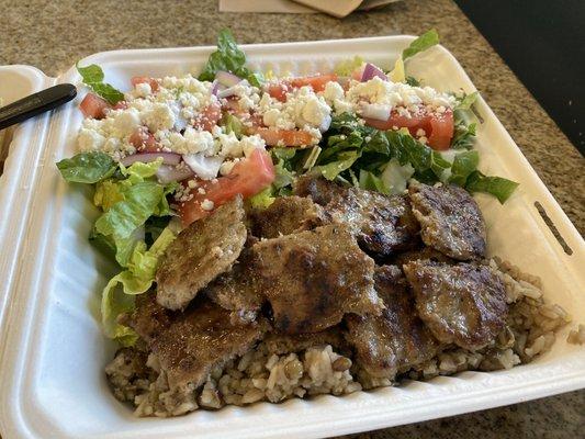 Gyro plate with salad and rice.