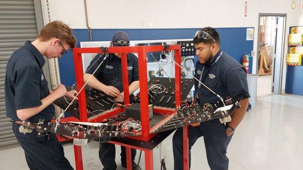 Students in the aircraft mechanic program practice their skills