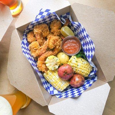 Fried fish with corn and potatoes