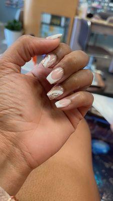 Fiona brought my inspiration to life! Acrylic coffin shaped French tips w/ gold glitter design.