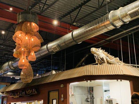 Interior (giant iguana & woven light fixture)