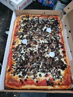 Sheet pizza with mushrooms and black olives. Really bland and expensive :(