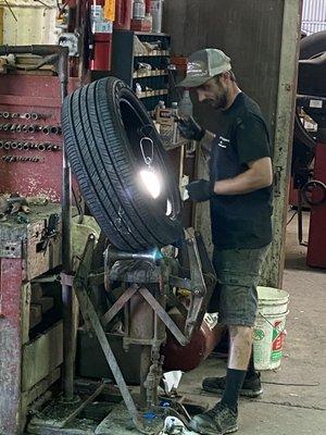 Cody is patching the hole in our tire! Thank you Cody!'