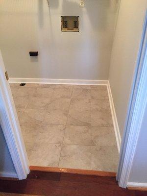 Floor tile in laundry room done well with base trim replaced.