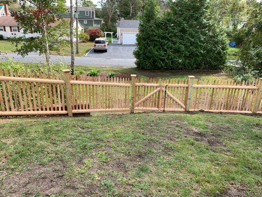 sloping picket day of install, ground was regraded after to repair tornado damage from fallen trees.