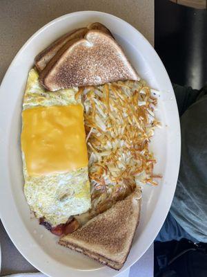 The Veggie Omelet with white toast and hash browns