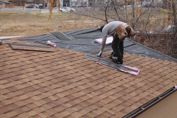 roofer repairing a roof in Parker, CO