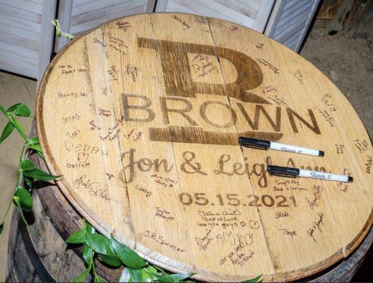 Authentic bourbon barrel tops engraved as a wedding guest book.