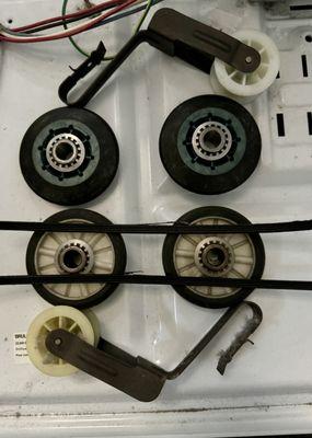 Old style Whirlpool gas dryer rollers with belt & idler pulley compared to new updated / heavy duty rollers.